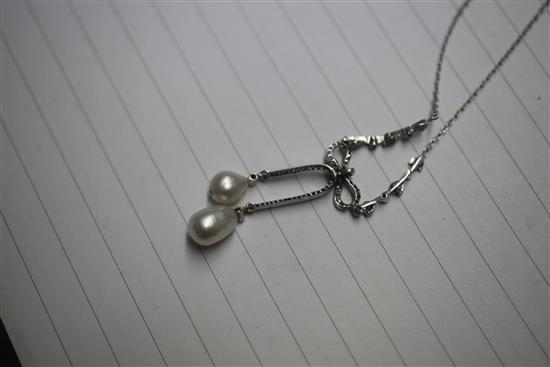 A Belle Epoque white metal natural saltwater pearl and diamond set double drop pendant necklace, 42cm.